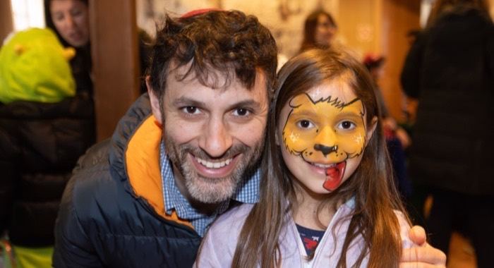 A father and daughter at a Chabad of Glencoe celebration